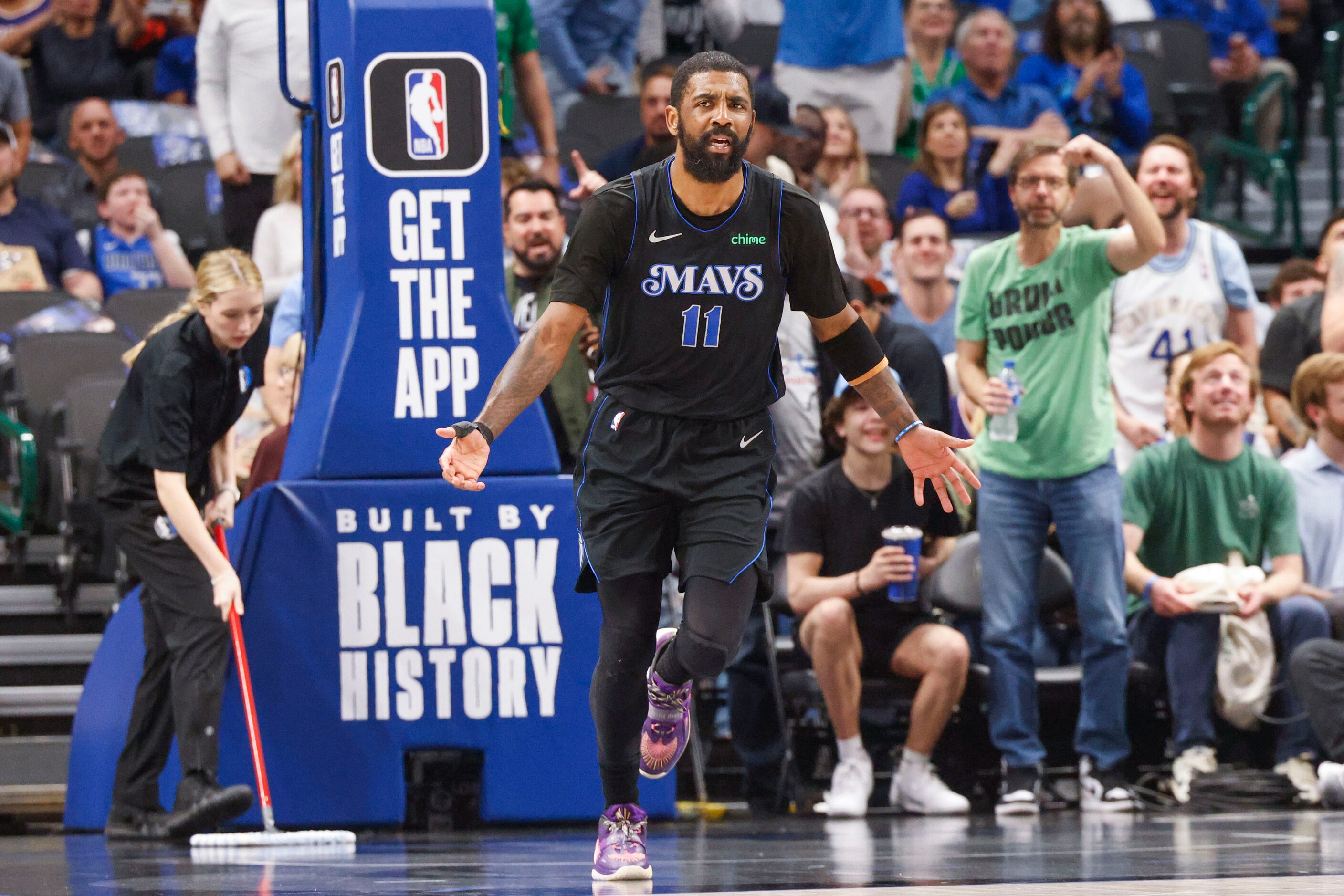 Dallas Mavericks guard Kyrie Irving reacts after he was denied a foul during the first half...