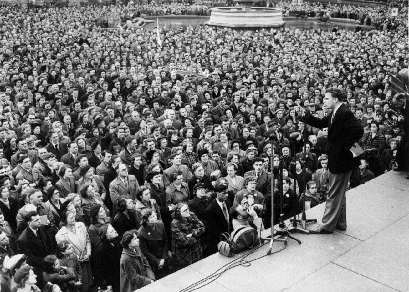 Evangelist Billy Graham addressing the congregation in Trafalgar Square in London.