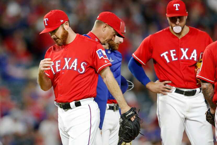 Texas Rangers relief pitcher Sam Dyson (47) exits the mound after Texas Rangers manager Jeff...