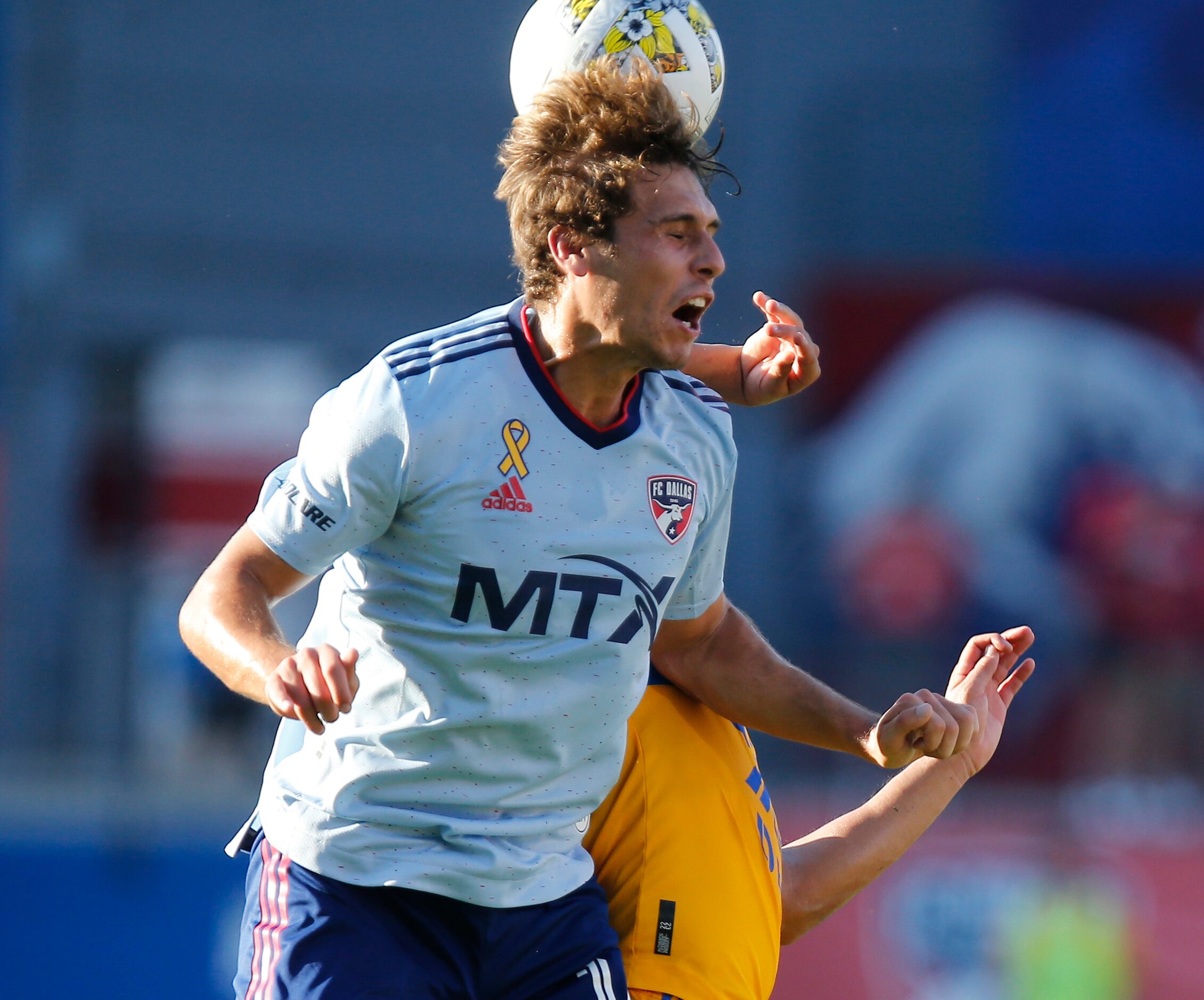 FC Dallas forward Beni Redžić (14) gets a header during the first half as FC Dallas hosted...