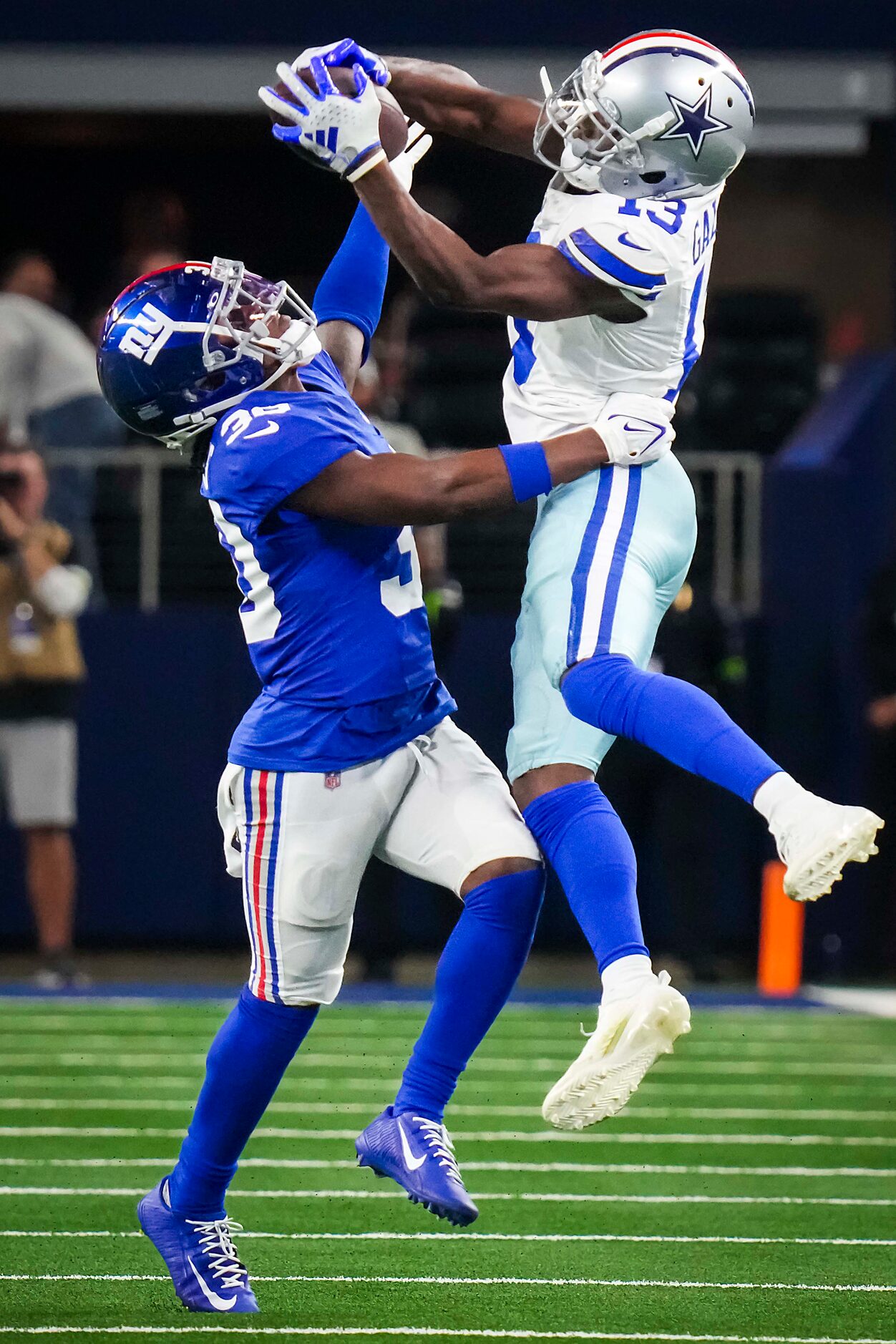 Dallas Cowboys wide receiver Michael Gallup (13) catches a 29-yard pass over New York Giants...