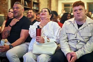 Viewers react during the Young Republicans' presidential debate watch party on Thursday in...