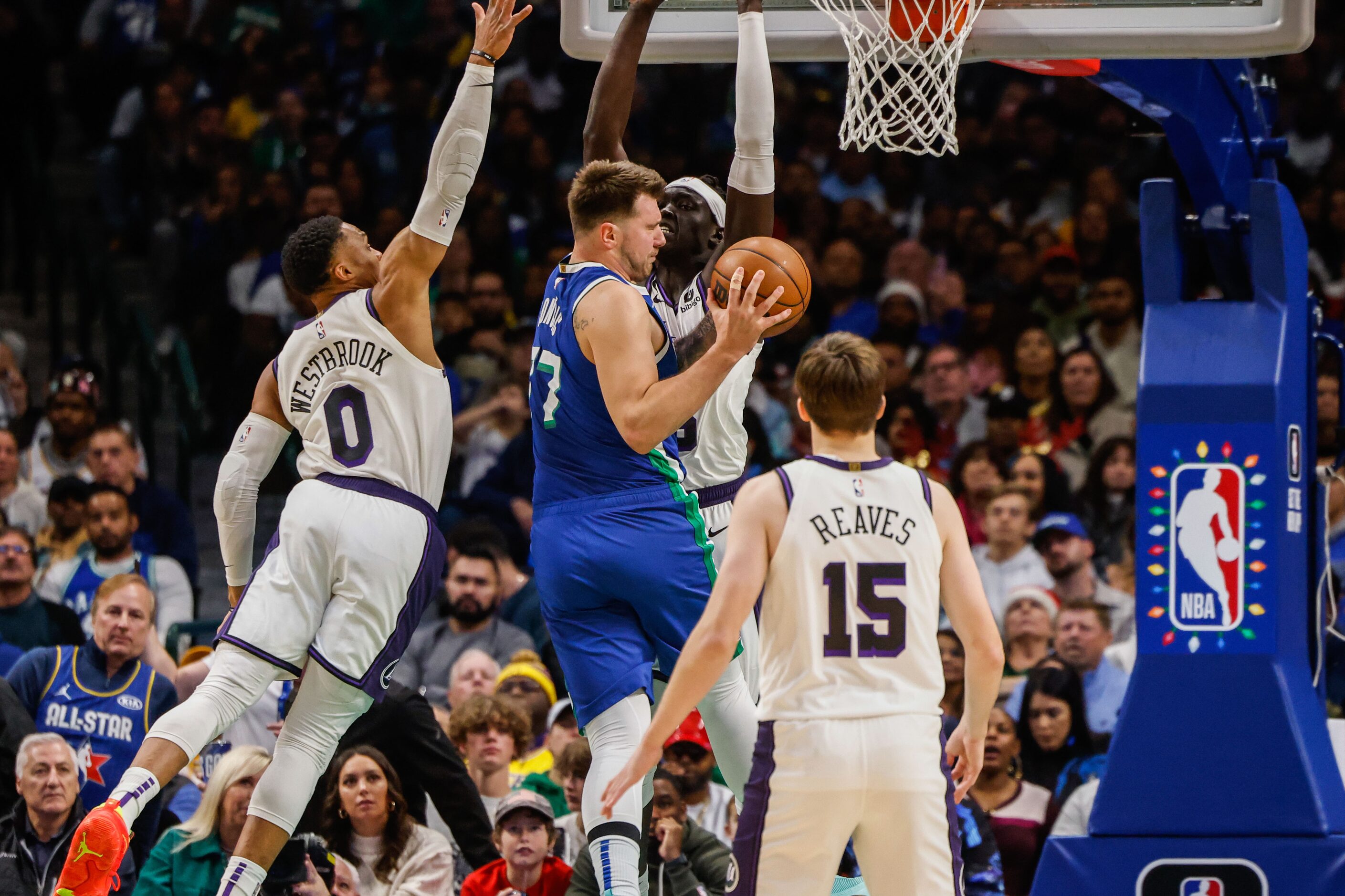 Dallas Mavericks guard Luka Doncic (77) goes for a shot while Los Angeles Lakers guard...