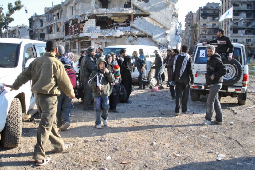 Civilians waited Sunday to be evacuated from a besieged district of Homs. A World Food...