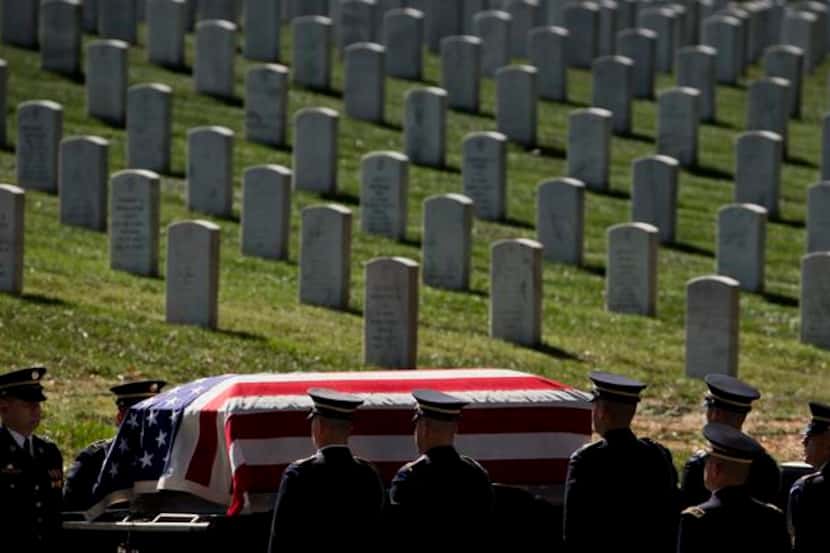 
A caisson carrying the casket containing the remains of Army Sgt. 1st Class Andrew T....