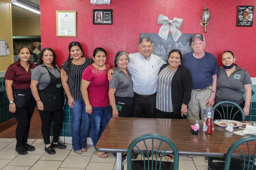 The staff of Acapulco’s stands with owner Refugio “Cuco” Bahena at Acapulco's in DeSoto,...