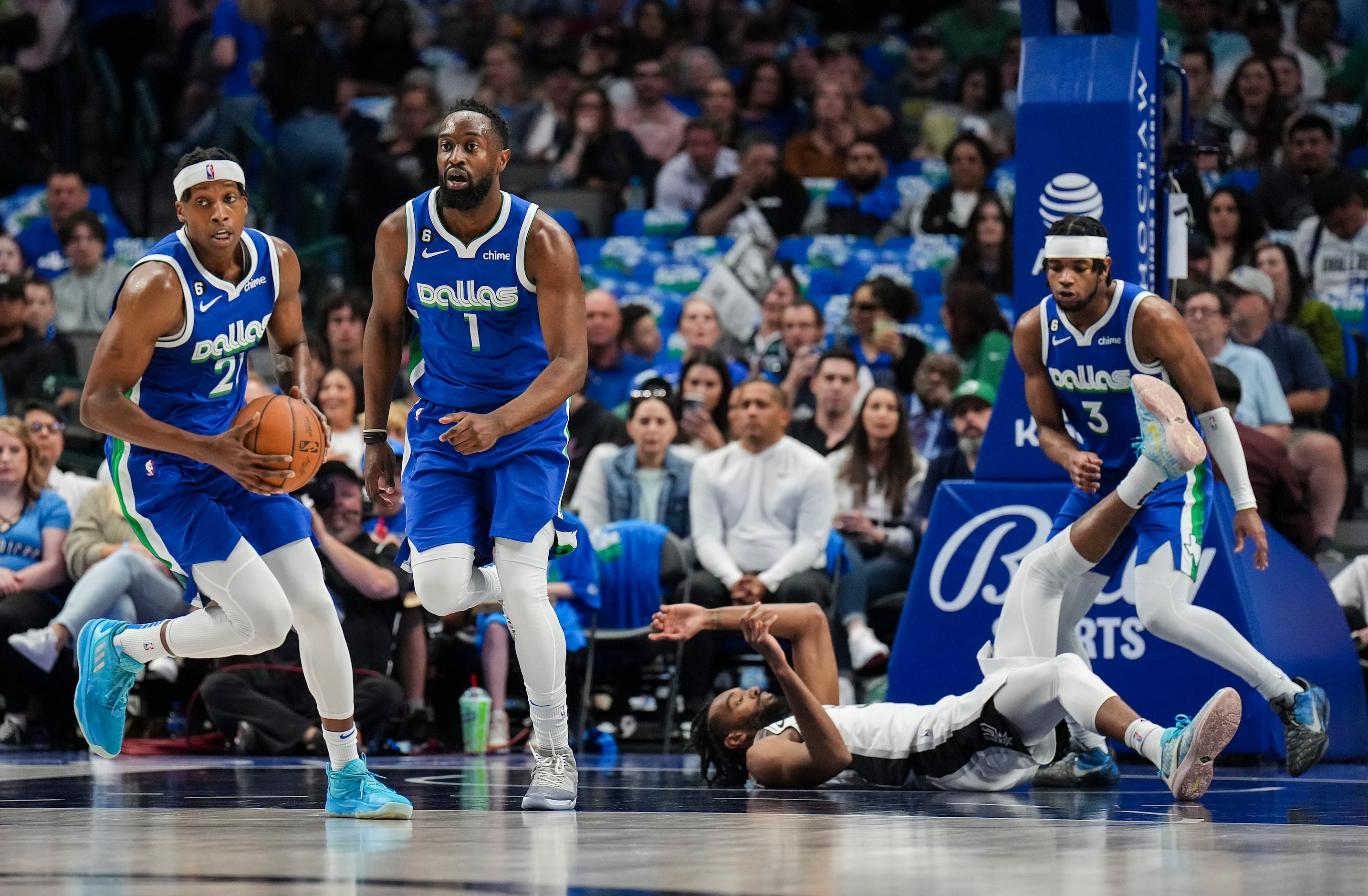 Dallas Mavericks guard Frank Ntilikina (21) brings the ball up the floor with guard Theo...