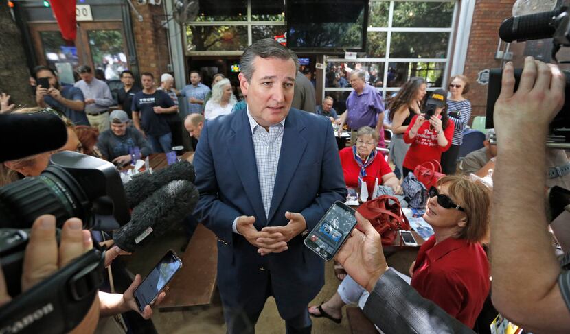 Sen.Ted Cruz does an interview before speaking to the crowd as he campaigns at the Katy...
