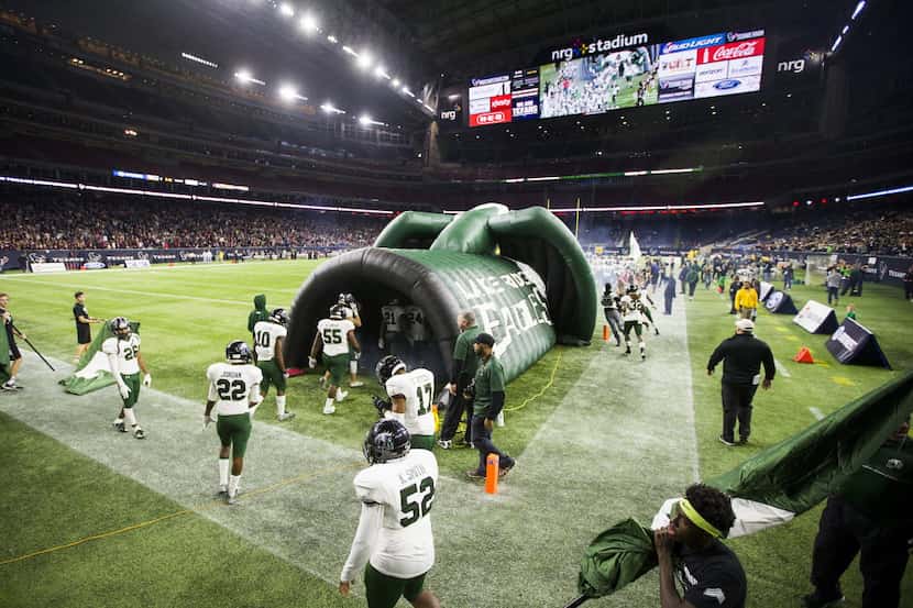 Mansfield Lake Ridge players take the field before the Class 5A Division I state...
