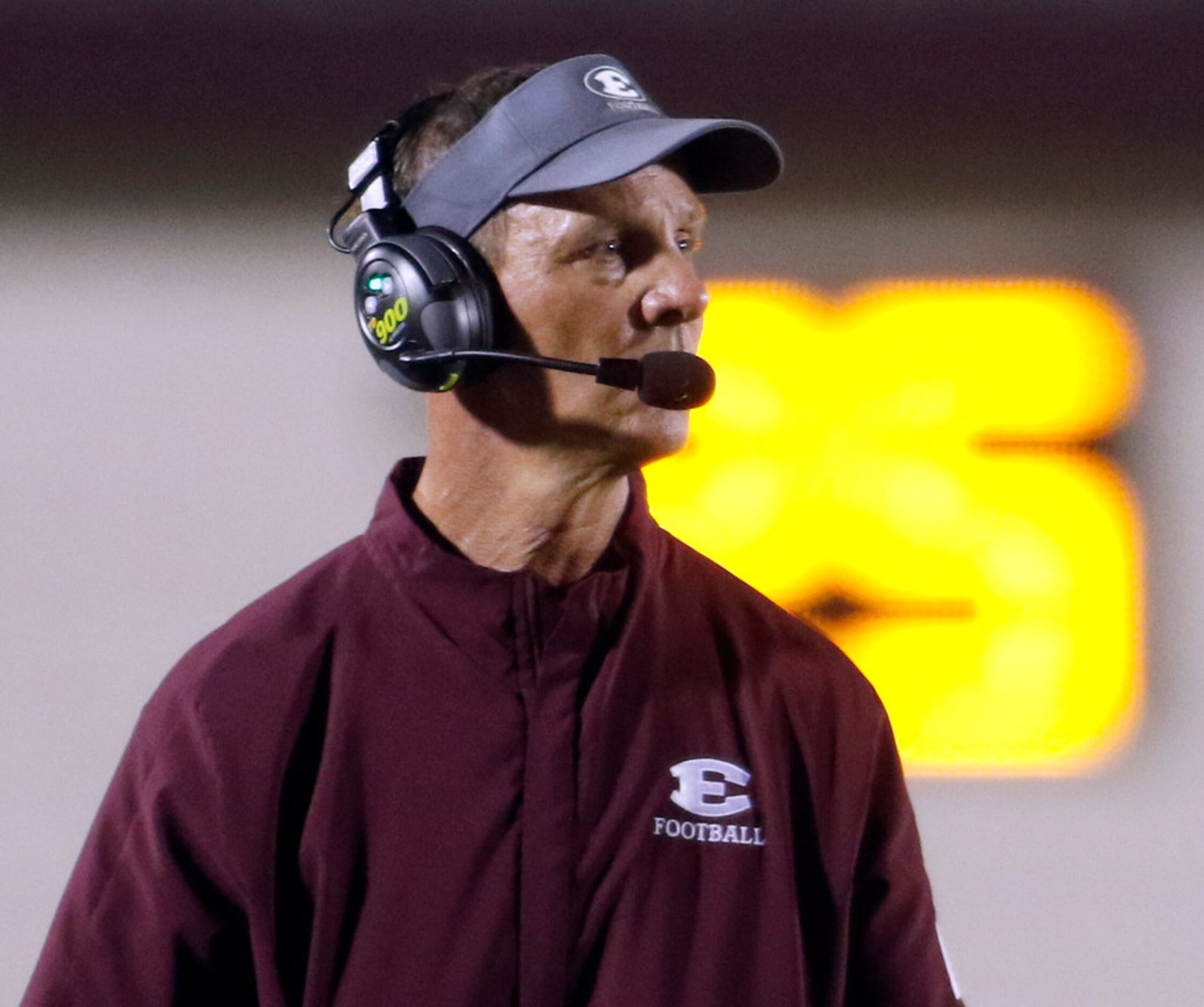 Ennis Lions head coach Sam Harrell watches intently from the team bench area during first...