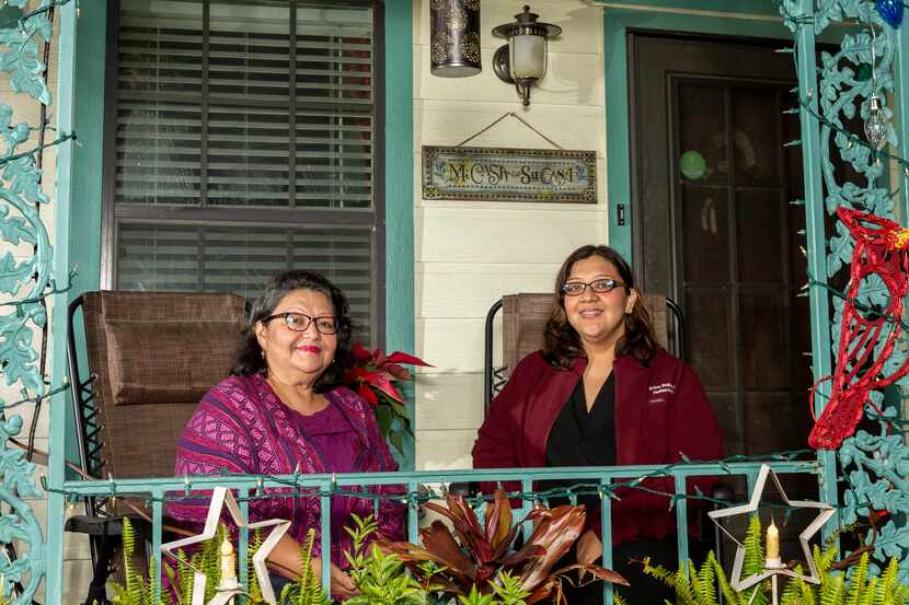 Debbie Solis (left) joins daughter Erica Solis, a pediatrician, outside the home the elder...