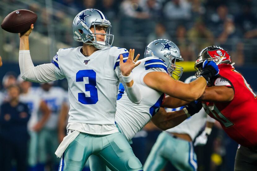 Dallas Cowboys quarterback Mike White (3) throws a pass during the first half of an NFL...