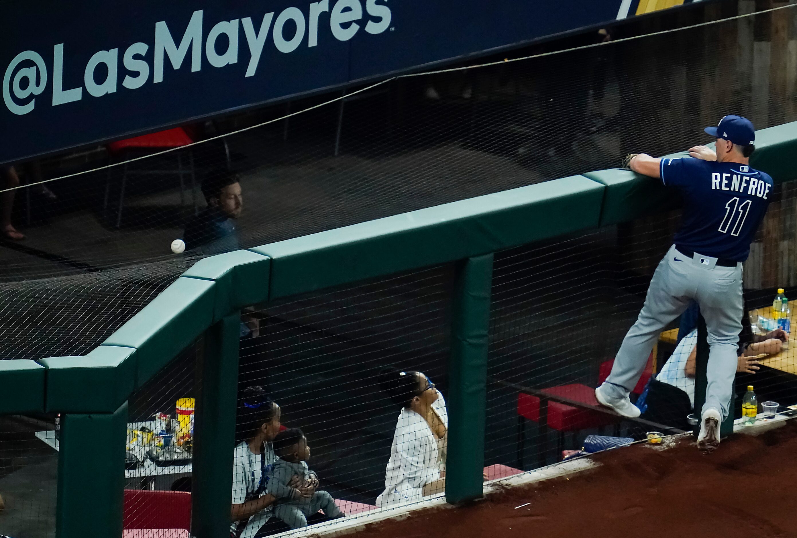 Tampa Bay Rays right fielder Hunter Renfroe can’t get to a foul ball off the bat of Los...