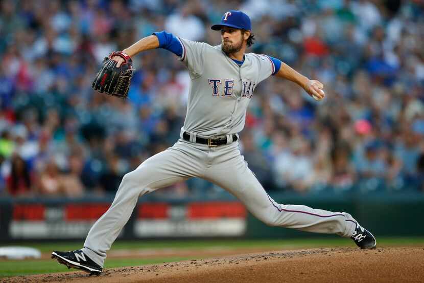 SEATTLE, WA - AUGUST 07:  Starting pitcher Cole Hamels #35 of the Texas Rangers pitches...