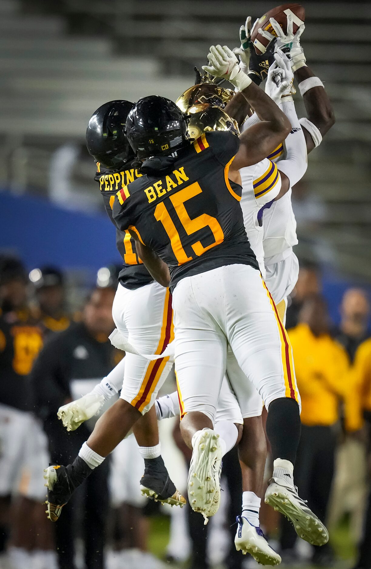 Prairie View’s DeJuan Lewis out leaps teammate Tariq Mulmore and Grambling tight end Noah...