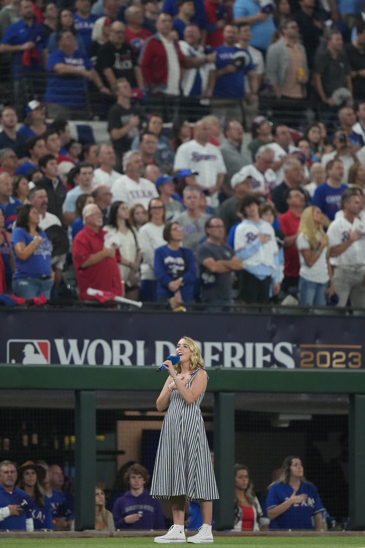 Nichole Johnson sings God Bless America during the seventh inning stretch in Game 2 of the...