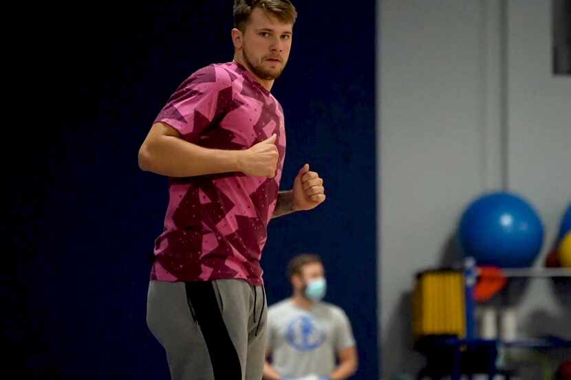 Dallas Mavericks guard Luka Doncic runs down the court during the first mandatory workout on...