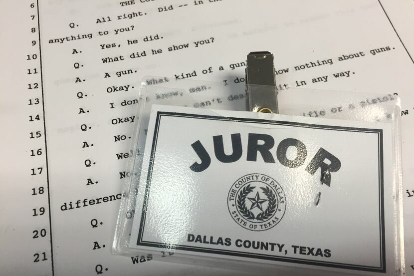Dallas County juror badge and a transcript.