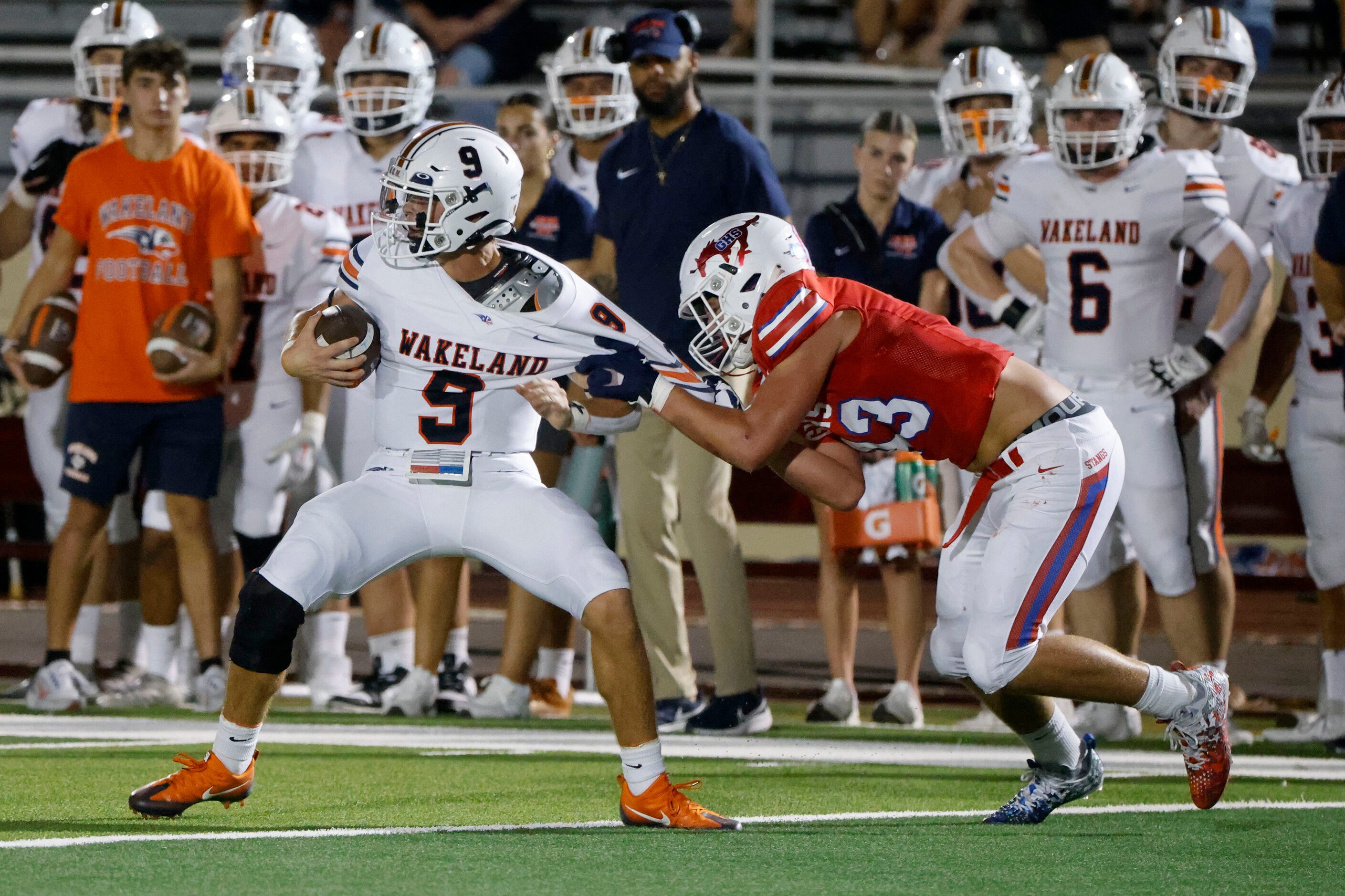 Frisco Wakeland quarterback Brennan Myer (9) is sacked by Grapevine’s Bradley Stanyer...