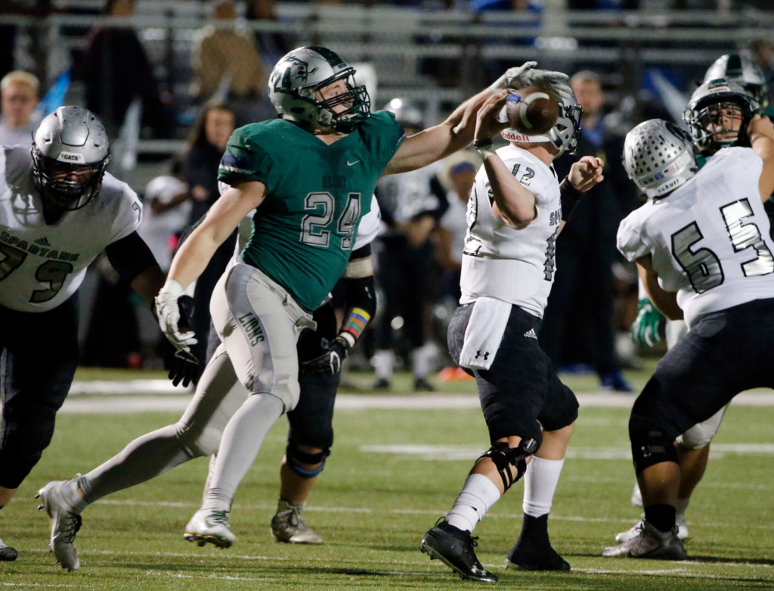 Frisco Reedy defensive end Matthew Hoots (24) forces a fumble by Burleson Centennial...