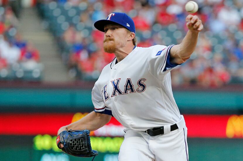 Texas Rangers relief pitcher Jake Diekman (41) throws a ninth-inning pitch during the...