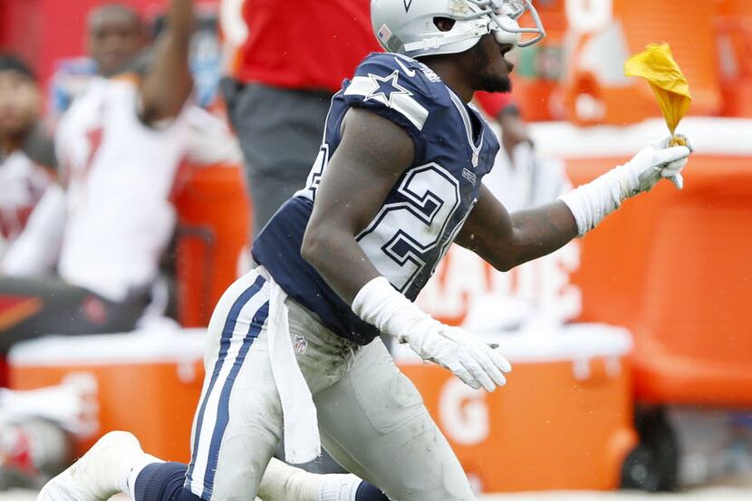 Dallas Cowboys cornerback Morris Claiborne (24) catches the penalty flag after he was called...