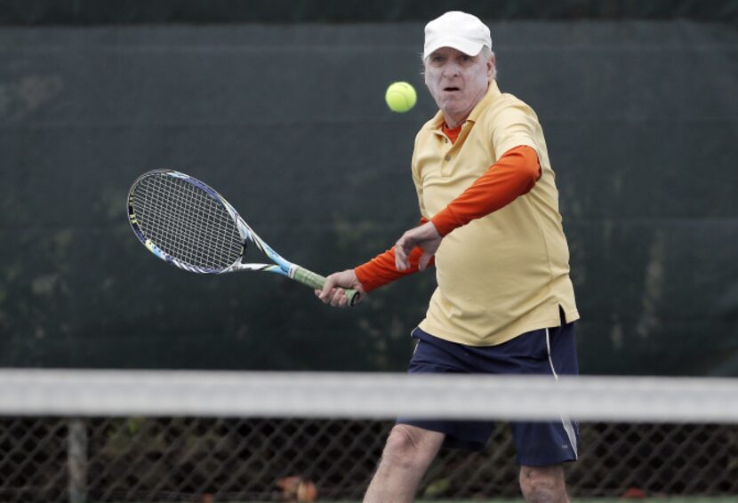 Keeping his eye on the ball, Joe Jameson gets set to hit a forehand.