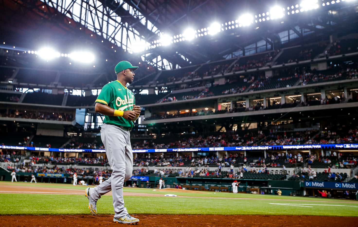 Oakland Athletics shortstop Elvis Andrus (17) heads to the dugout before the start of a...