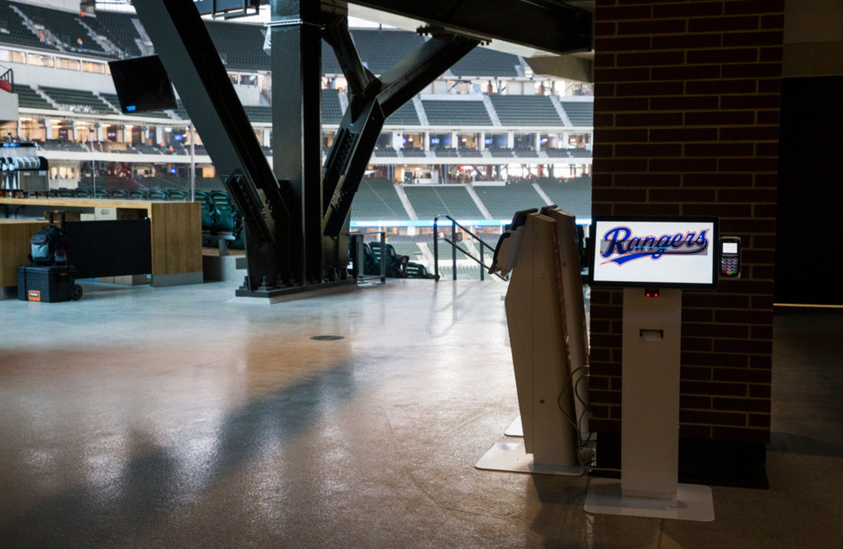 A digital kiosk shows the Rangers logo on the main concourse during an open house for the...