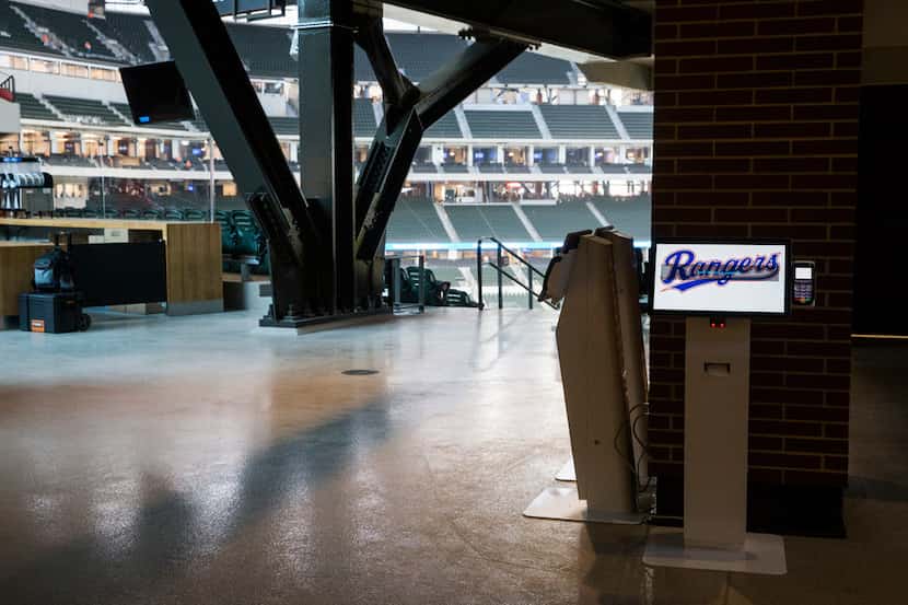 A digital kiosk shows the Rangers logo on the main concourse during an open house for the...