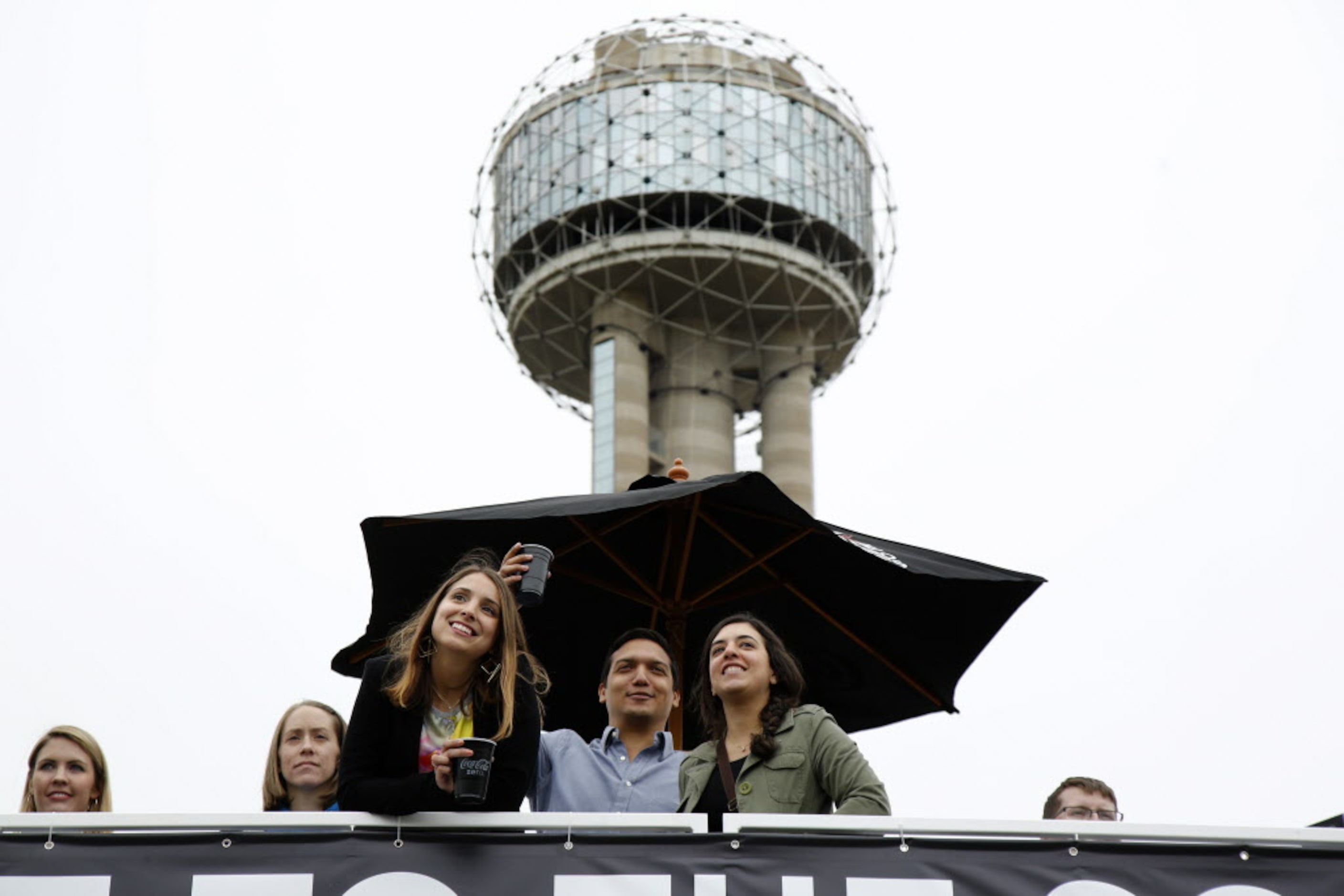 Fans watch the LL Cool J concert from the Coca-Cola social Arena during the March Madness...