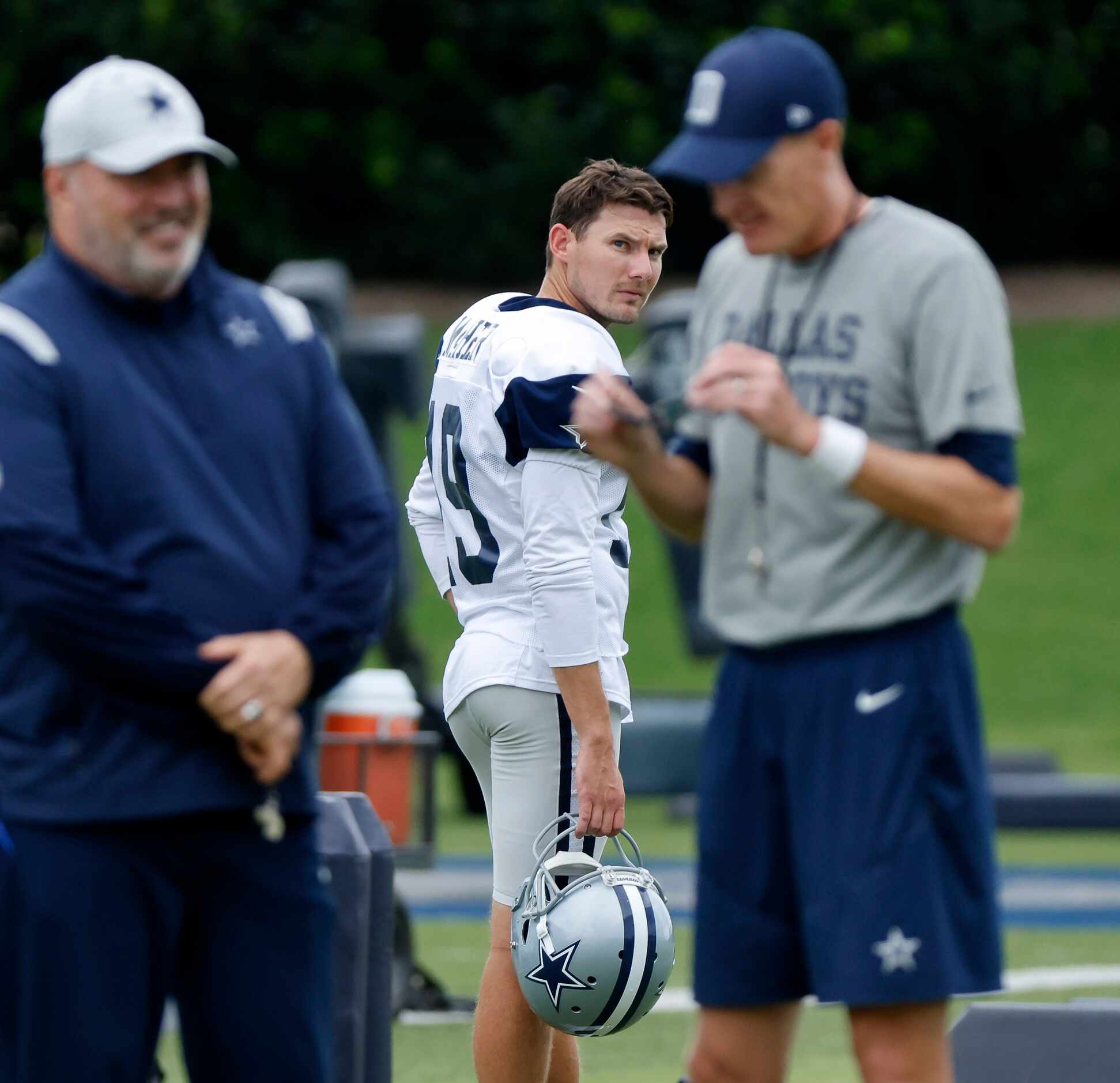 Dallas Cowboys place kicker Brett Maher (19) looks back at head coach Mike McCarthy and...