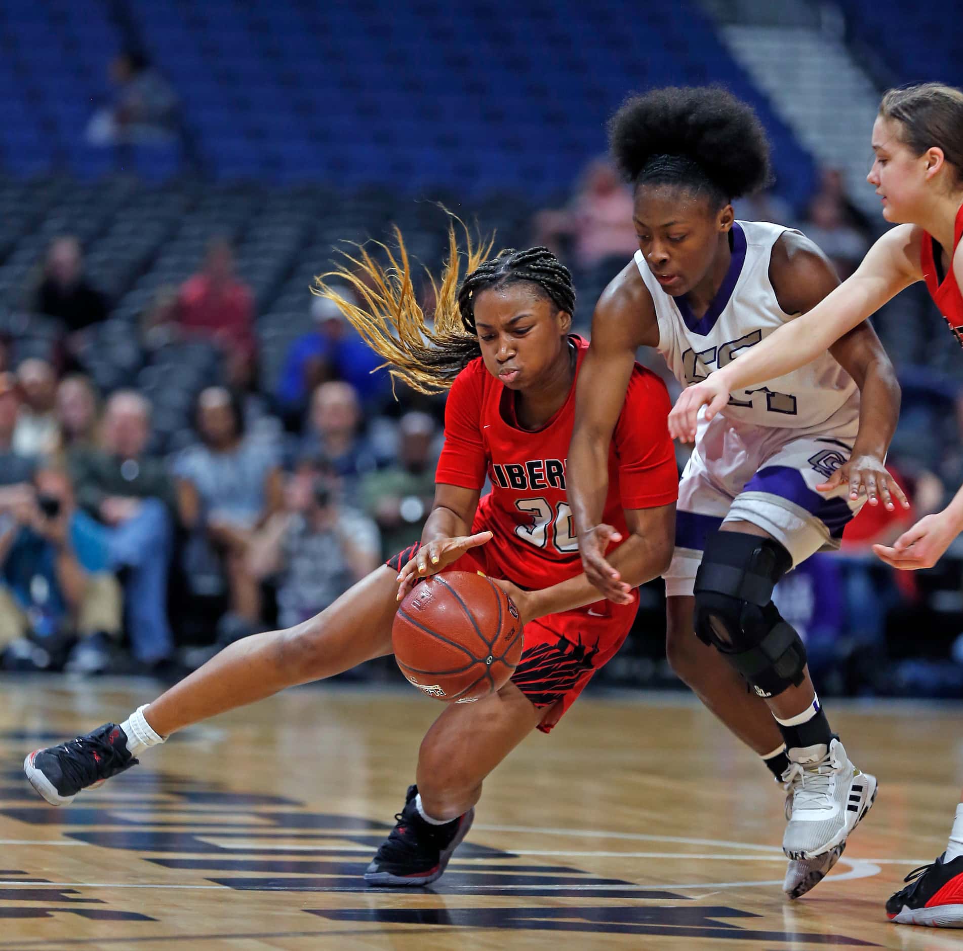 Frisco Liberty Jazzy Owens-Barnett is fouled by C15\ in fourth quarter in a 5A semifinal on...