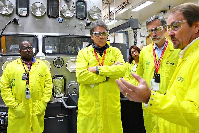 U.S Secretary of Energy Rick Perry, second from left, accompanied by Laboratory Director...