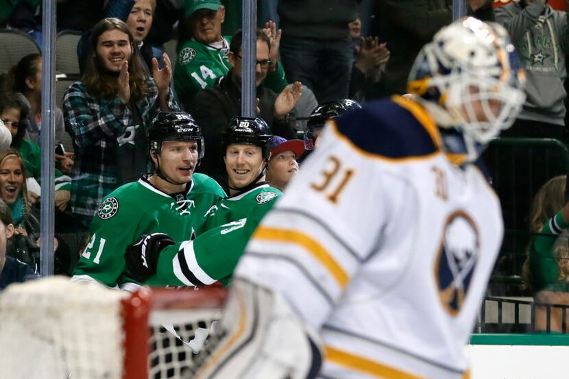Buffalo Sabres goalie Chad Johnson (31) stands by the net as Dallas Stars' Antoine Roussel...