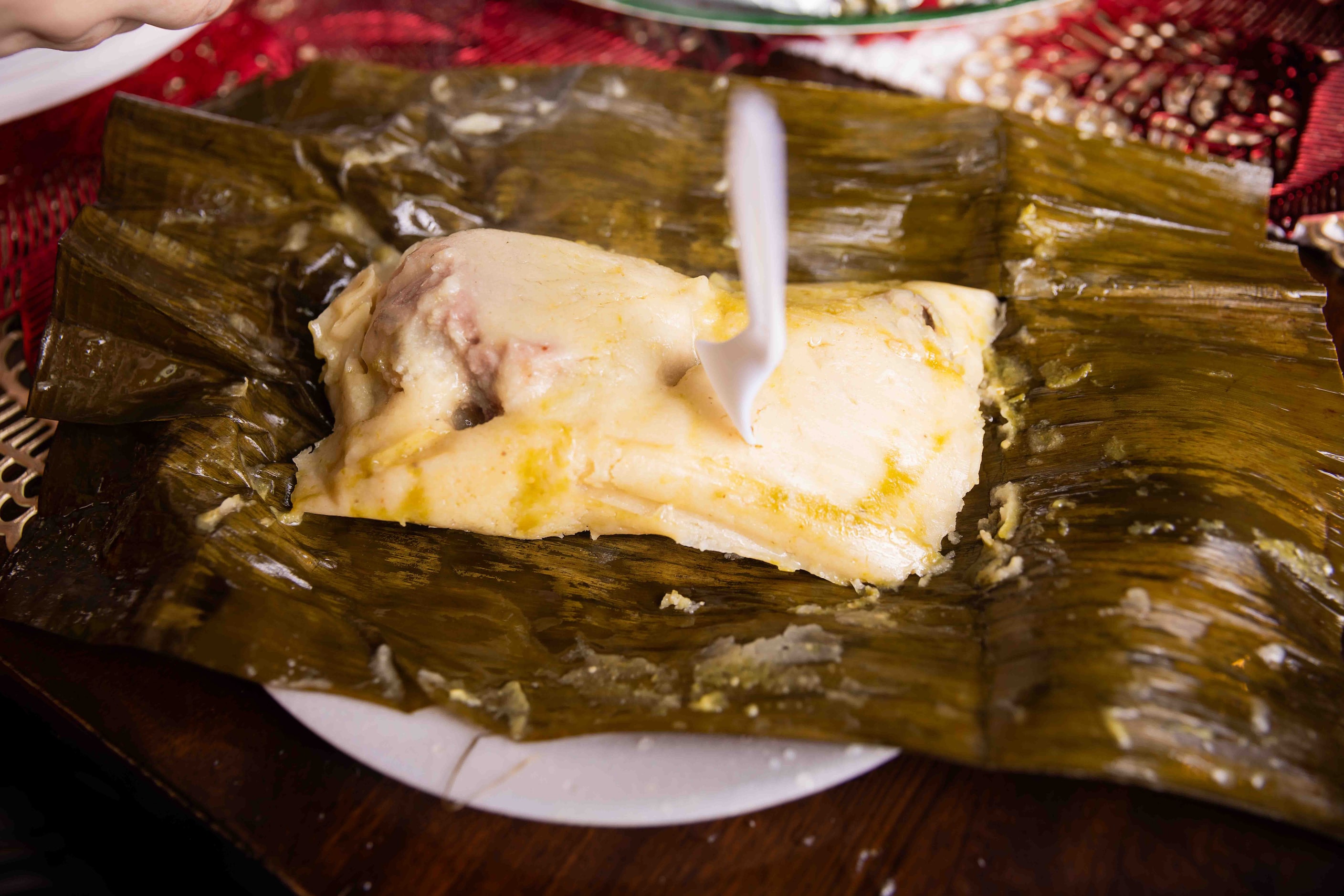 A chicken tamale in a banana leaf made by Sara Klein (not pictured), the hostess behind the...