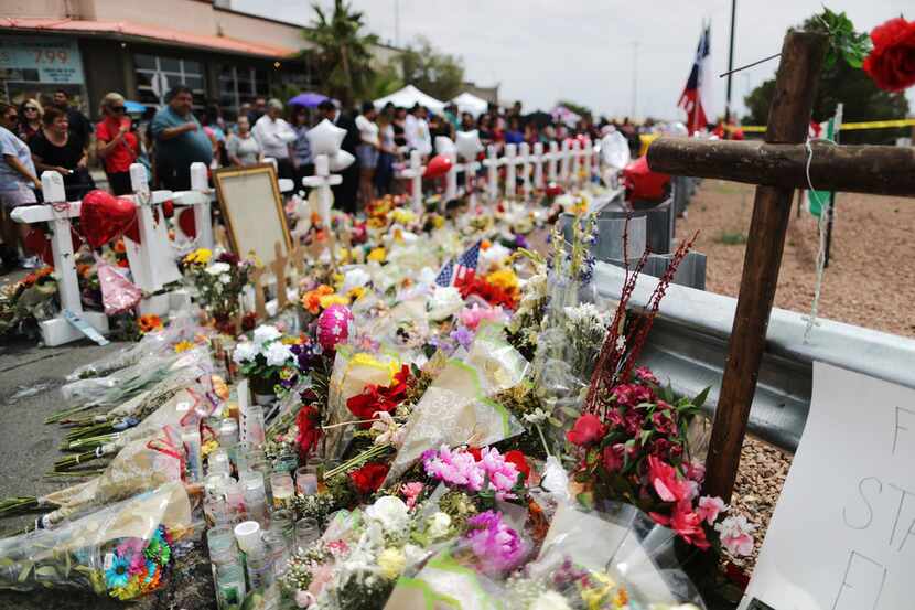 People visited a memorial honoring victims outside Walmart, near the scene of a mass...