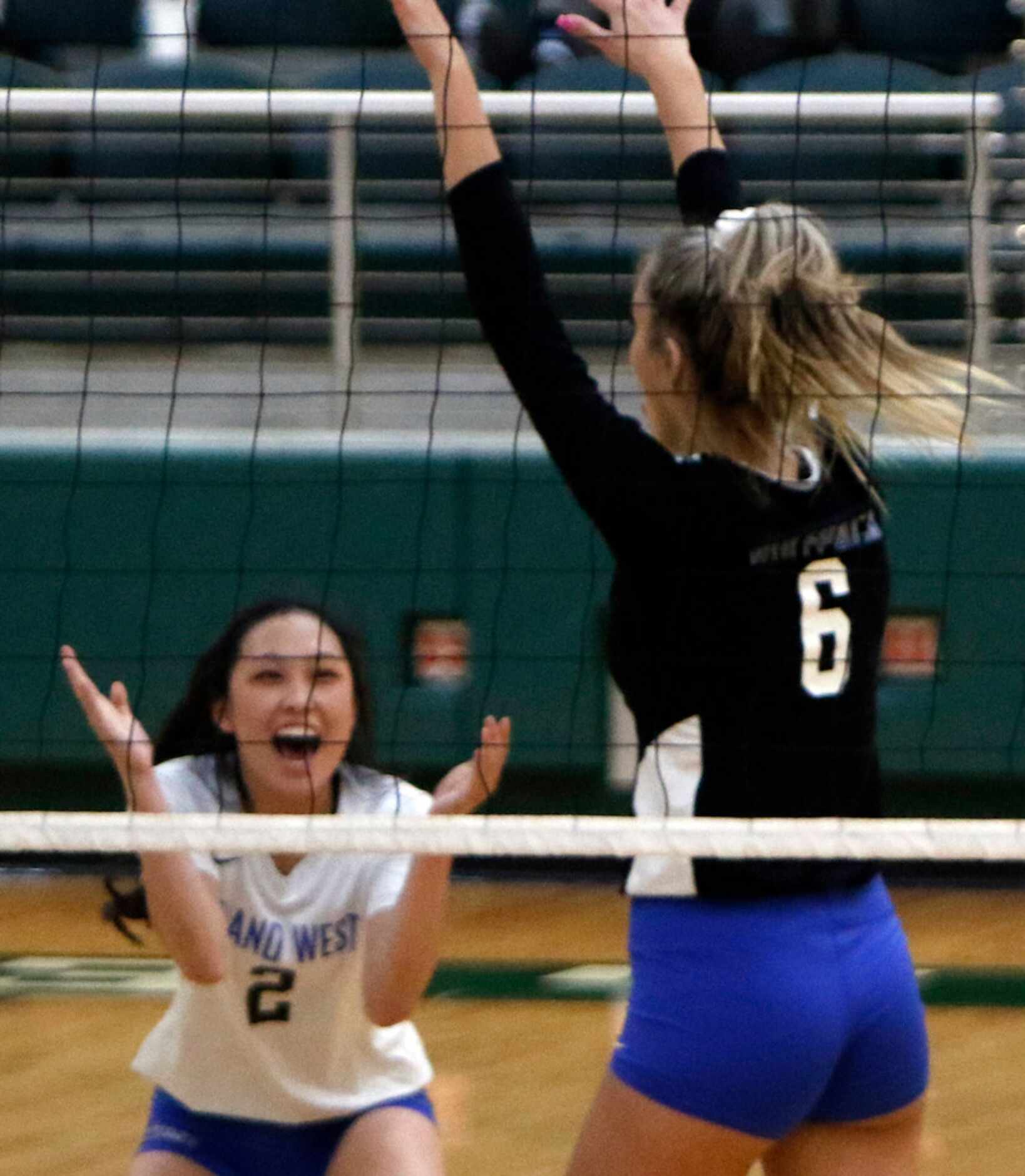 Lindsey Zhang (2) of Plano West, was all smiles after teammate Noelle Piatas (6) blocked the...