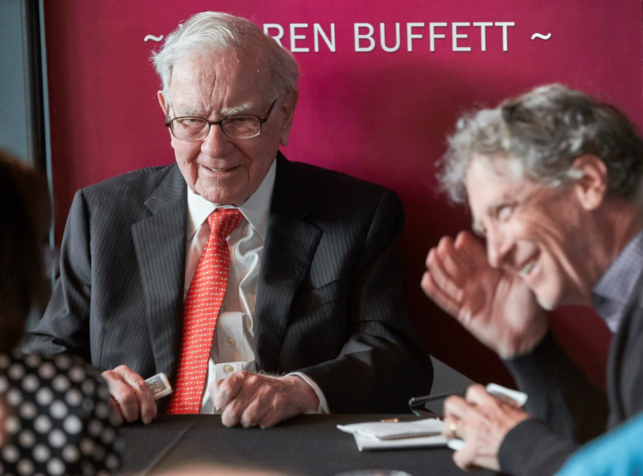 Warren Buffett plays bridge with Gill Gates after the annual Berkshire Hathaway shareholders...