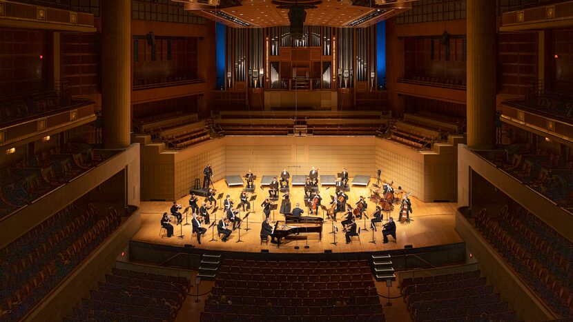 DSO music director Fabio Luisi conducts a socially distanced orchestra before a socially...