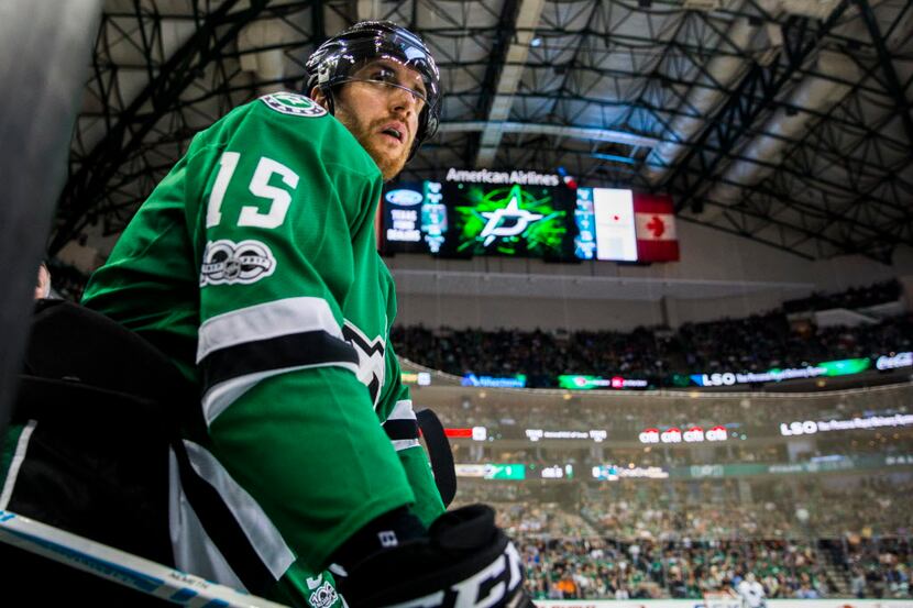 Dallas Stars defenseman Patrik Nemeth (15) watches from the bench during the second period...