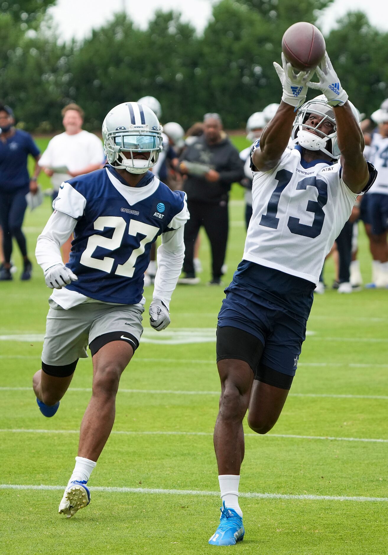 Dallas Cowboys wide receiver Michael Gallup (13) reaches for a pass as cornerback Trevon...