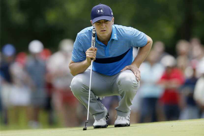 Jordan Spieth eyes up his putt on the third hole during the AT&T Byron Nelson at TPC Las...