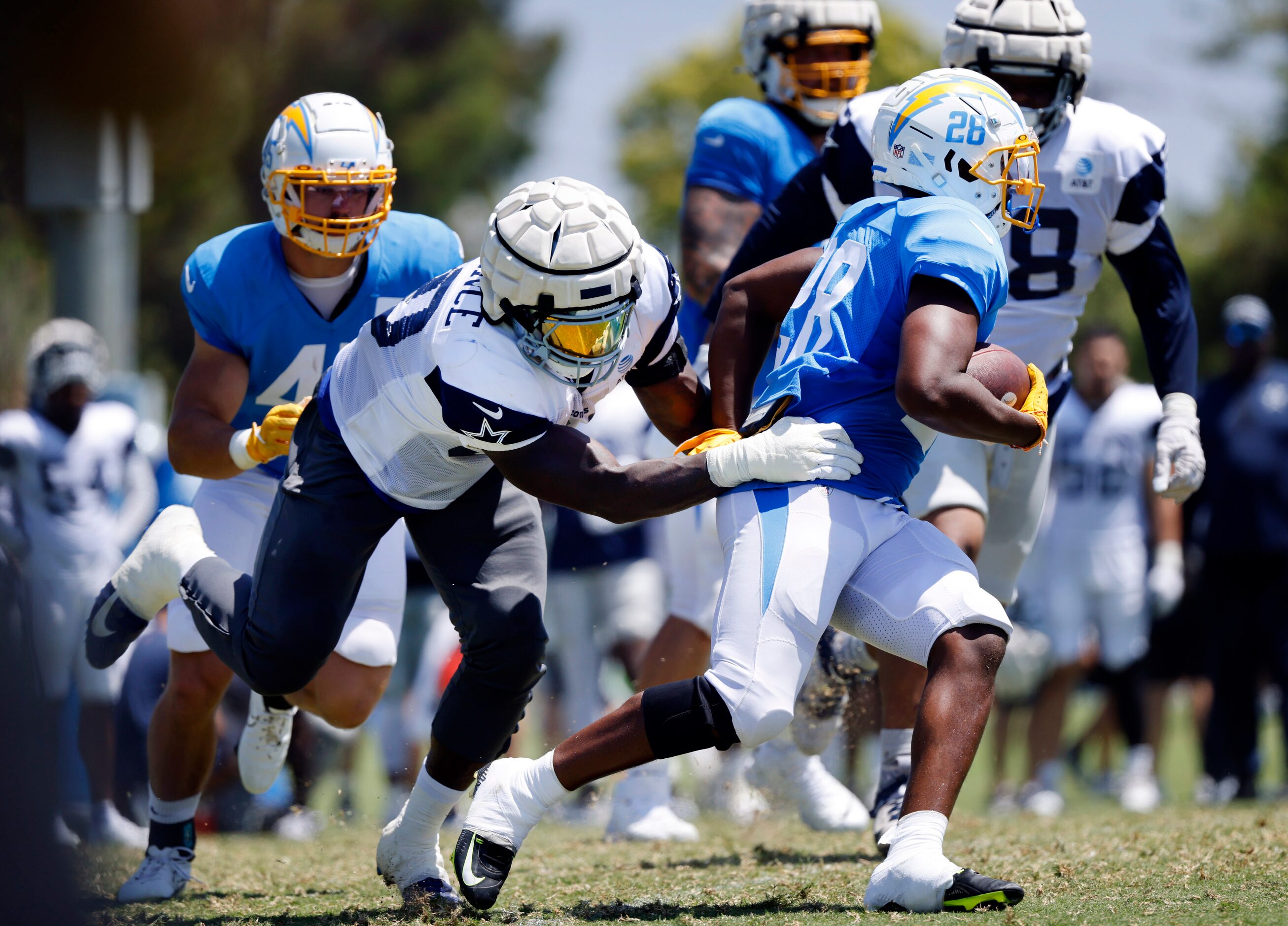 Dallas Cowboys defensive end DeMarcus Lawrence (90) chases down Los Angeles Chargers running...