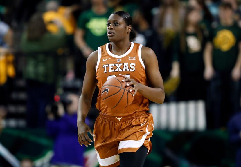 Texas guard Joyner Holmes (24) moves then all up court against Baylor during an NCAA college...