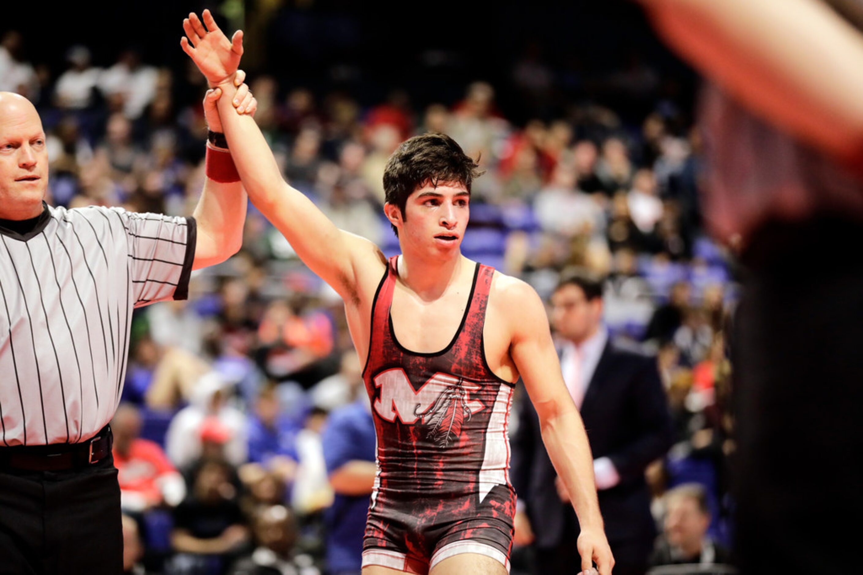 Dominic Chavez of Arlington Martin wrestles during the UIL Texas State Wrestling...