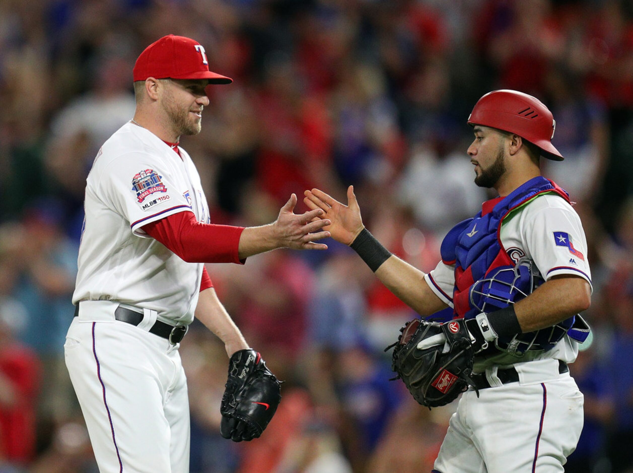 ARLINGTON, TEXAS - MAY 31: Shawn Kelley #27 celebrates with Isiah Kiner-Falefa #9 of the...