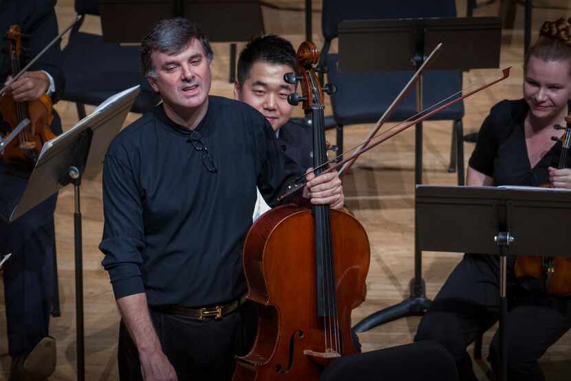 Cello soloist Andres Diaz stands for applause at the conclusion of Leonard Bernstein's Three...