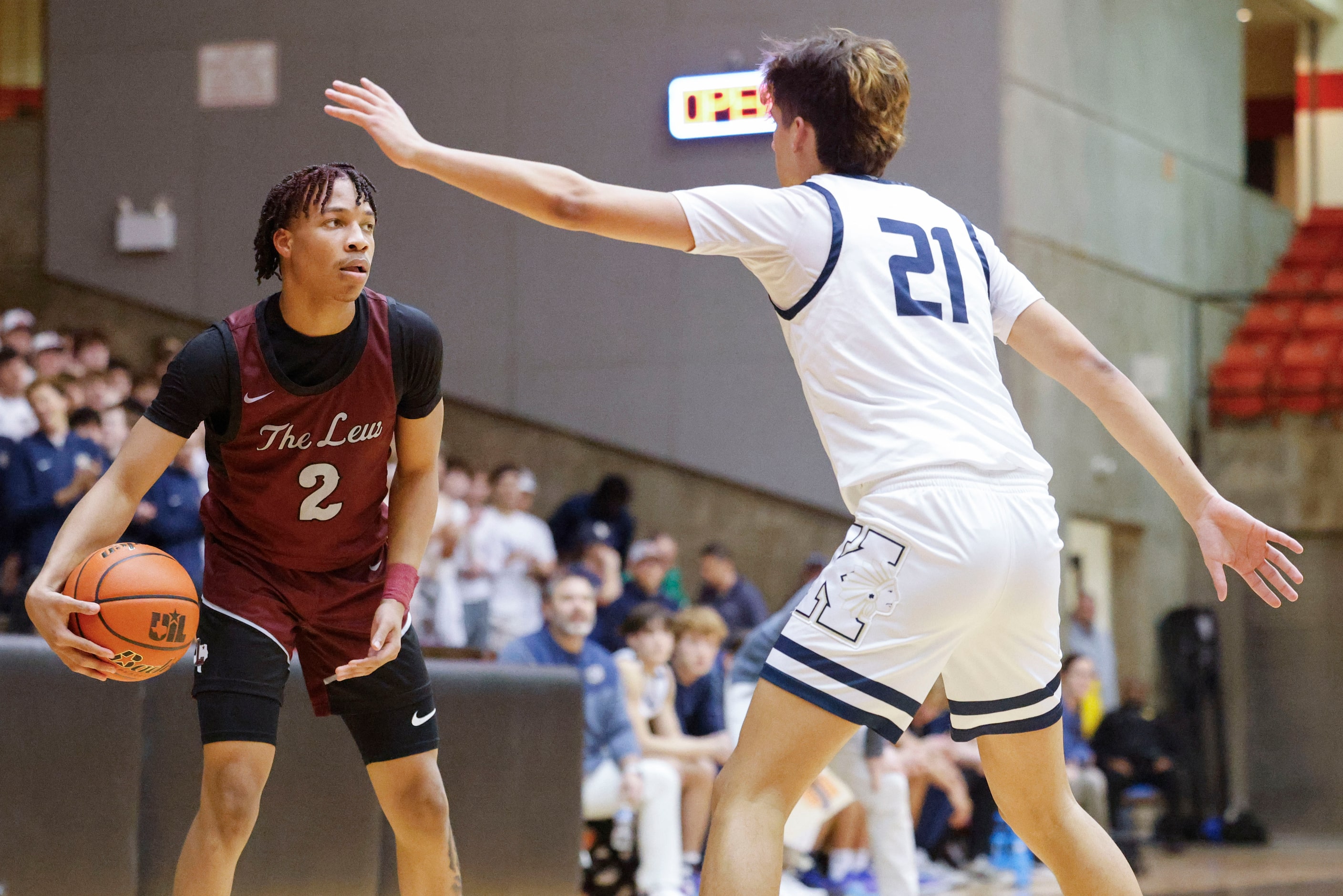 Lewisville High’s Rakai Crawford (left) looks to pass past Keller high’s Cooper Guerra...