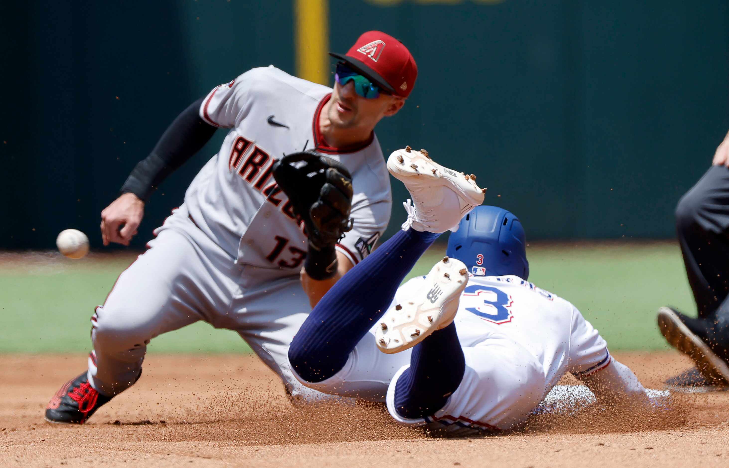 Texas Rangers Leody Taveras (3) is tagged out stealing by Arizona Diamondbacks shortstop...